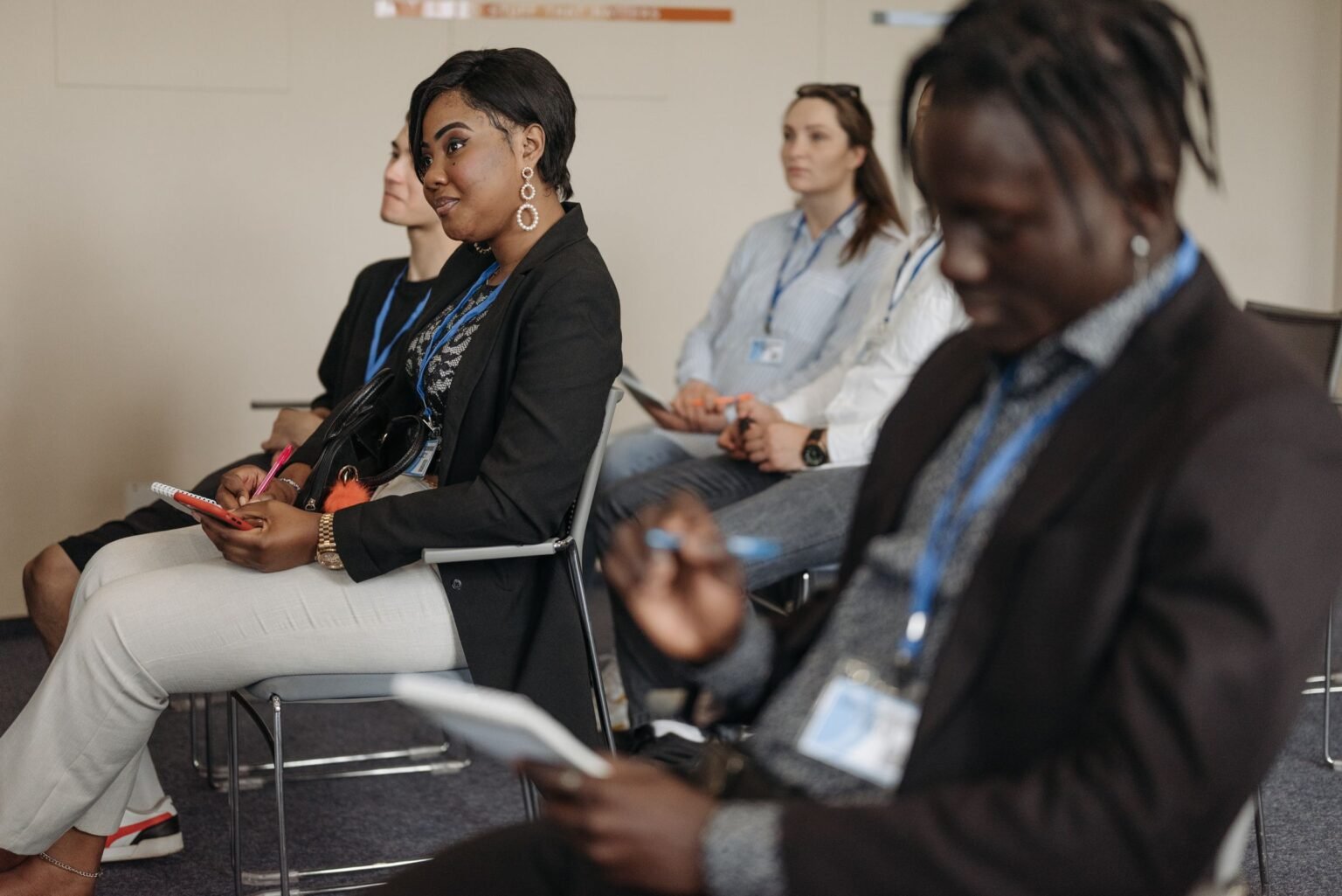 Participants taking notes during a working session.