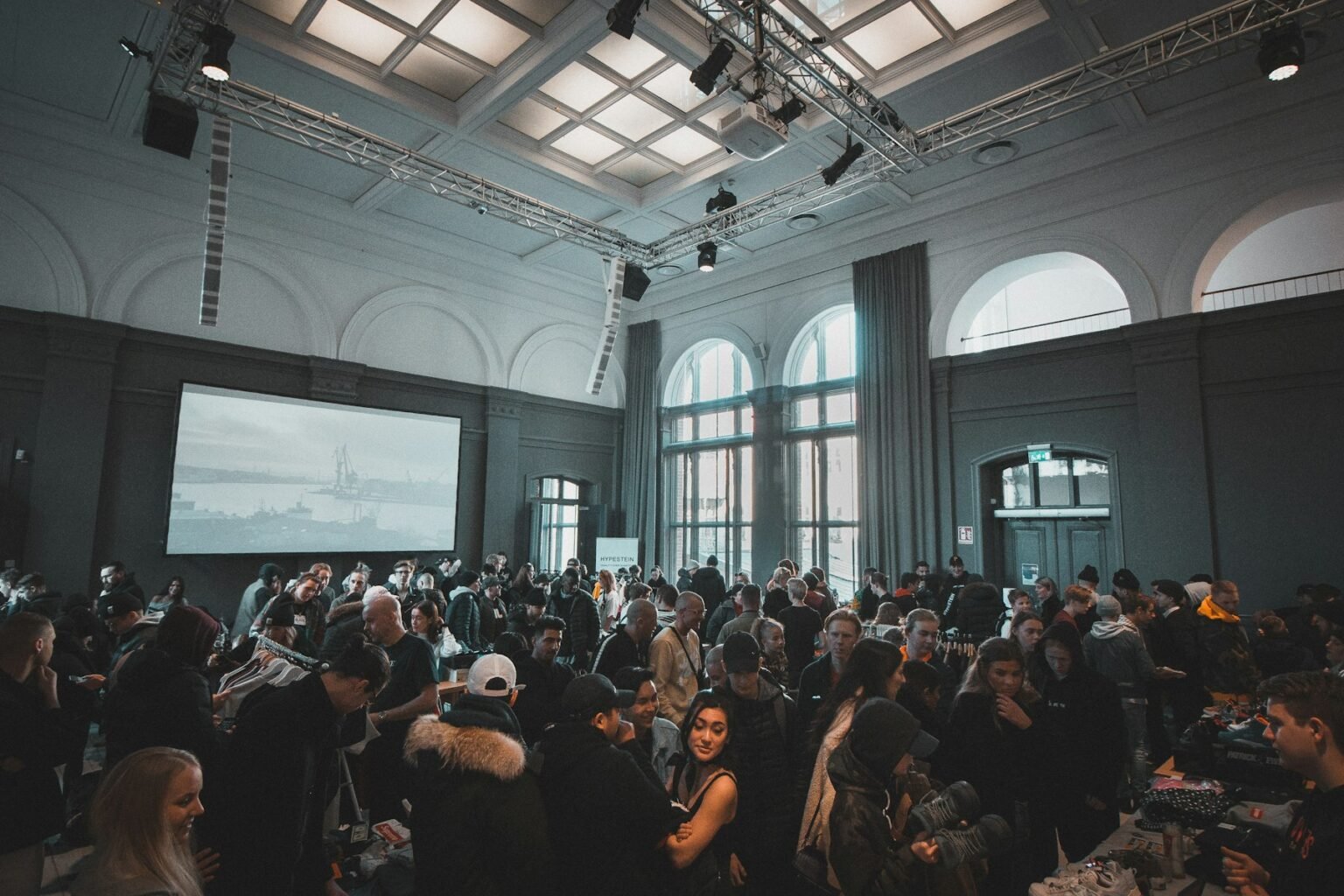 An audience listening to a speaker at an international conference.
